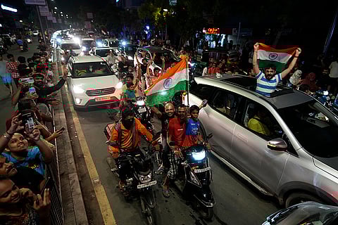 Cricket fans celebrate in Ahmedabad